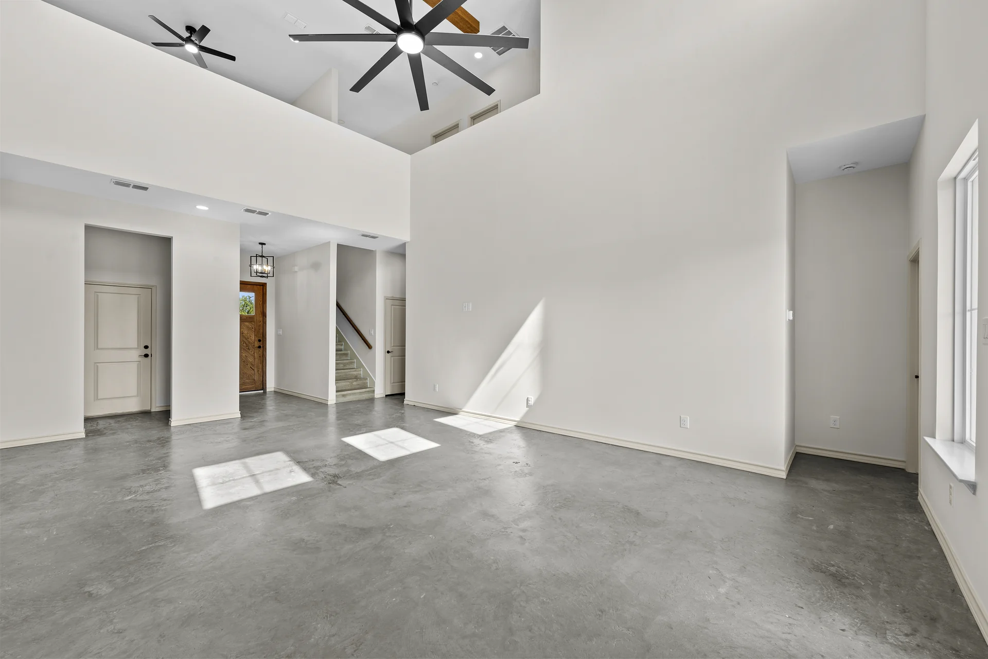 Open interior with polished concrete floors during finish-out, built by Go To Guys RGV